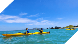 People kayaking in turqouise water